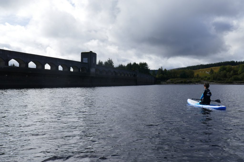 paddleboarding near the dam on Clatteringshaws Loch